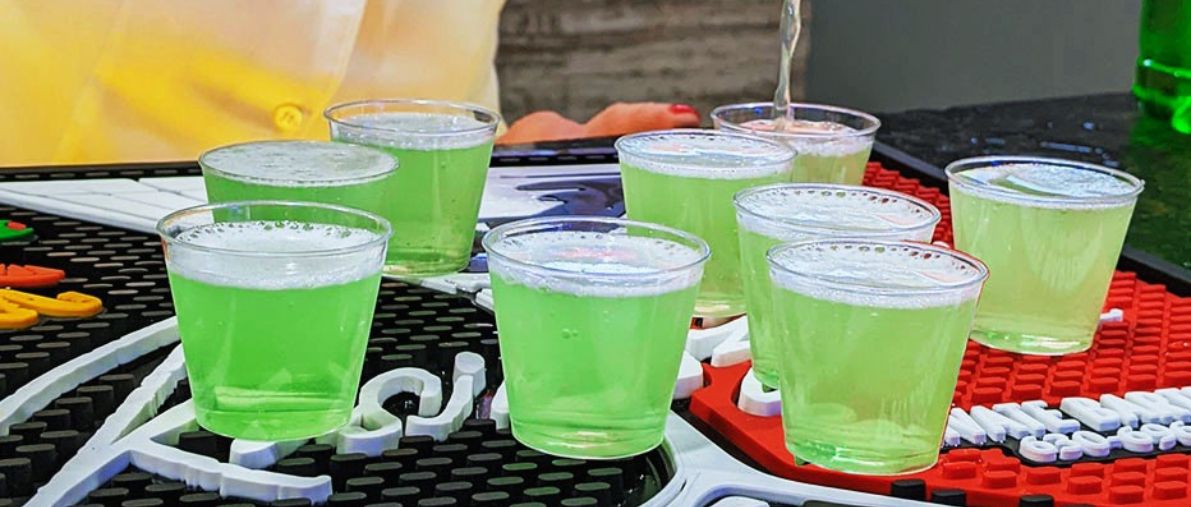 Some cocktail glasses in green color