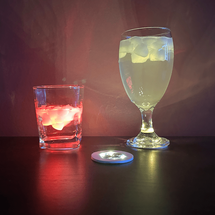 A Glass With a Yellow Color Glass and Another With Orange