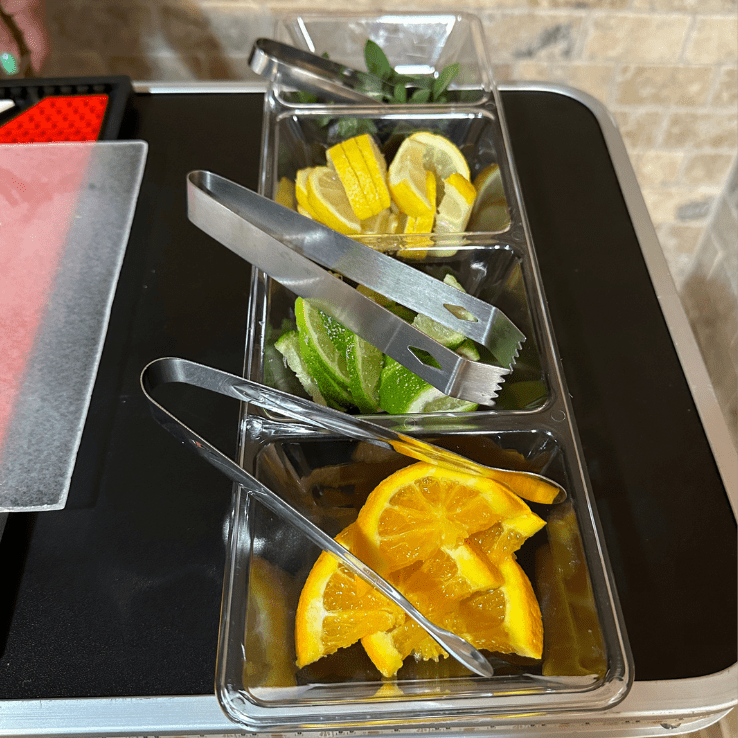 A plate filled with different ingredients for a making a drink