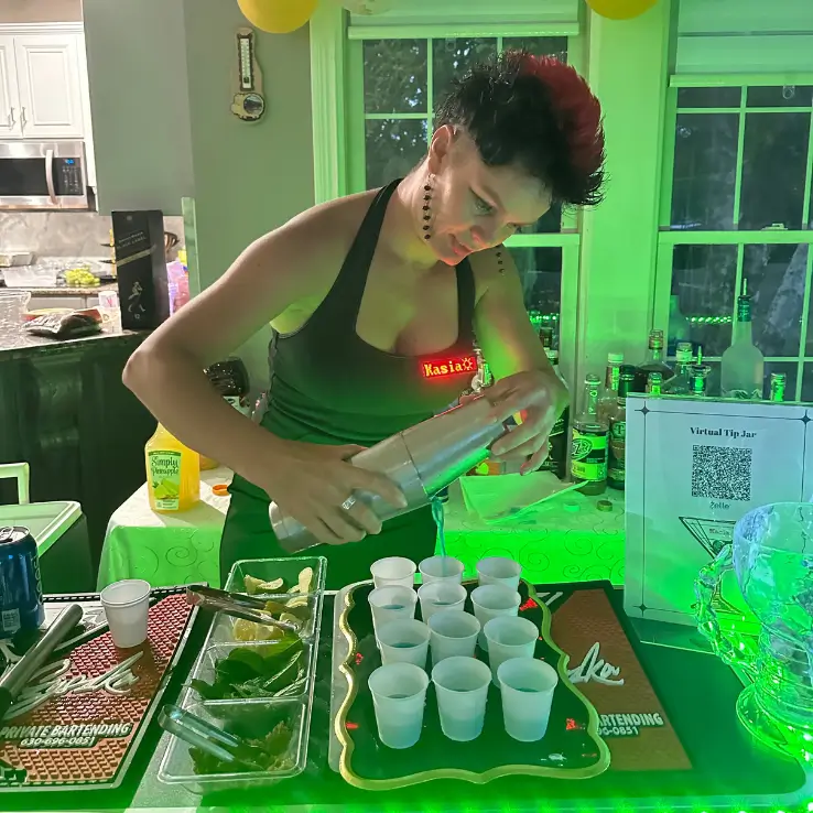 a woman serving drinks in cups